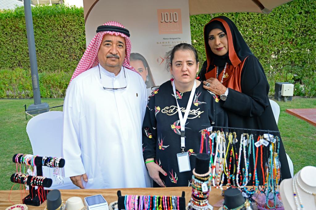 Dr. Shafiqa Al Ameri and Murshid Al Shamsi with one of the people of determination IMG 1